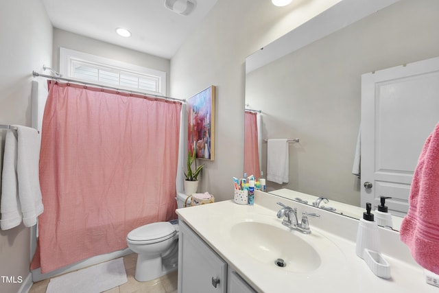 bathroom featuring vanity, shower / bath combination with curtain, toilet, and tile patterned flooring