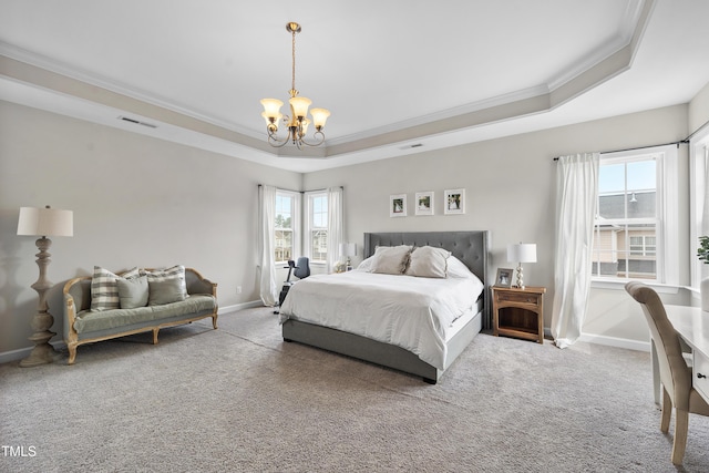 carpeted bedroom featuring a chandelier, visible vents, baseboards, and a tray ceiling