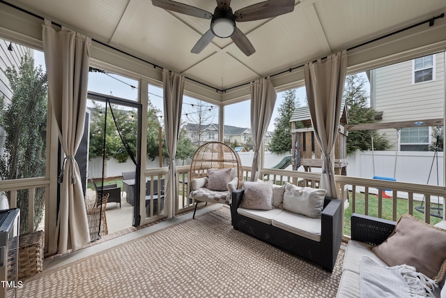 sunroom with a ceiling fan