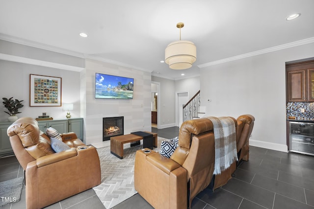 tiled living room featuring stairway, wine cooler, baseboards, and a tile fireplace