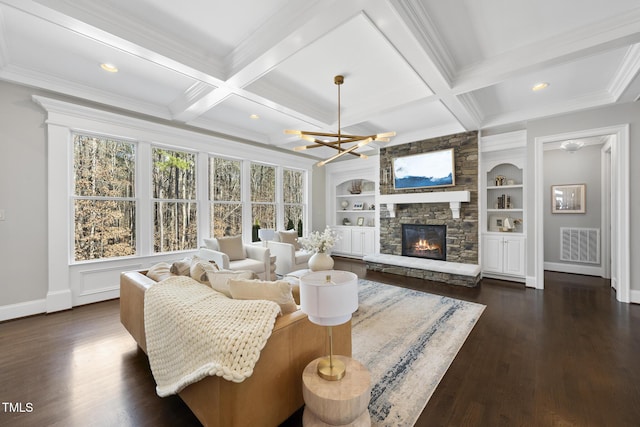 living room with beam ceiling, visible vents, coffered ceiling, and a stone fireplace