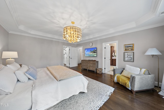 bedroom with visible vents, wood finished floors, connected bathroom, an inviting chandelier, and crown molding