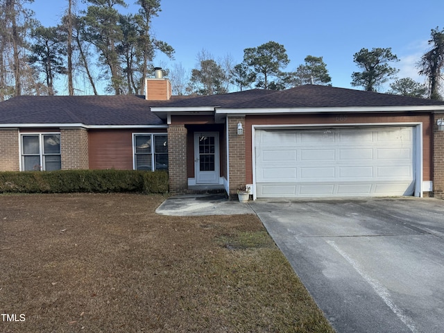 ranch-style house with concrete driveway, an attached garage, brick siding, and a chimney