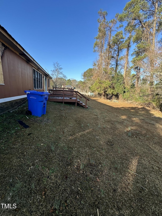 view of yard with a deck