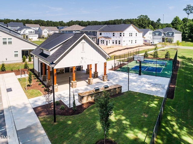 birds eye view of property with a residential view