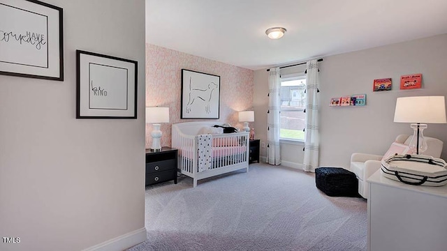 bedroom featuring carpet flooring and baseboards