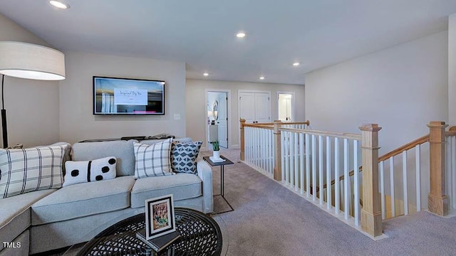 living area with recessed lighting and carpet