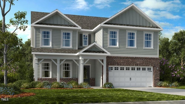 view of front of home with brick siding, board and batten siding, a front lawn, a garage, and driveway