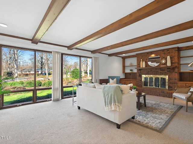 carpeted living room featuring a brick fireplace and beamed ceiling