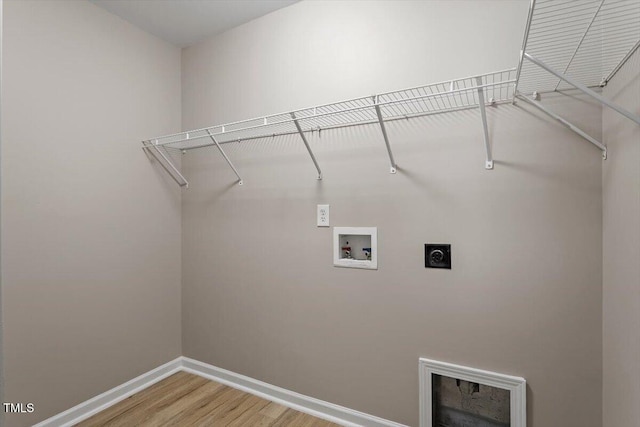 laundry room featuring washer hookup, light wood-style flooring, baseboards, hookup for an electric dryer, and laundry area