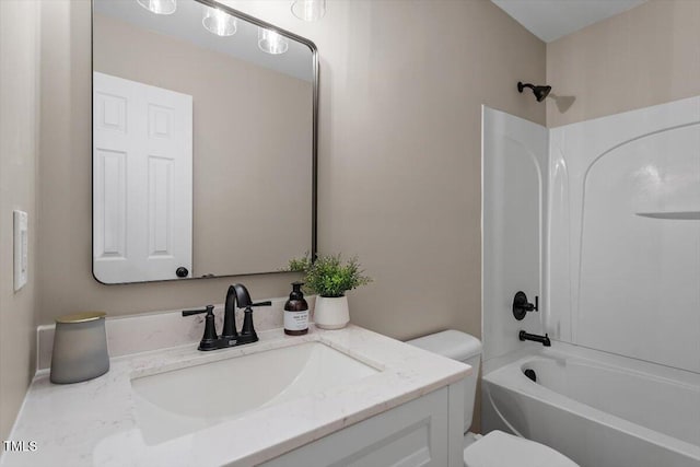 full bath featuring tub / shower combination, toilet, and vanity