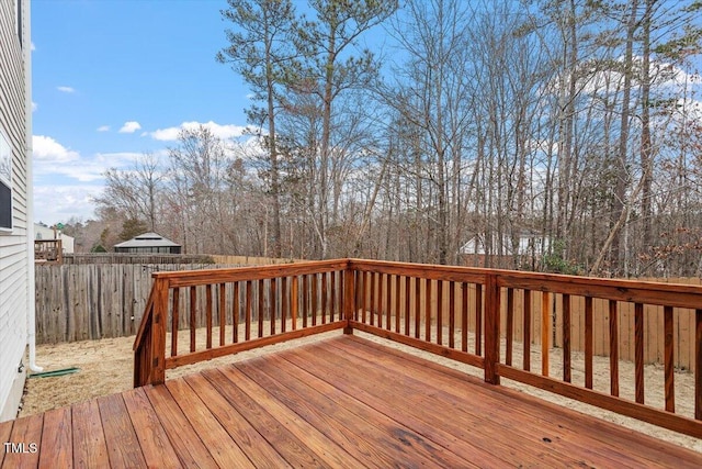 wooden deck featuring fence