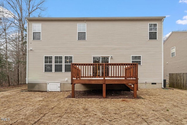 rear view of property featuring crawl space and a wooden deck