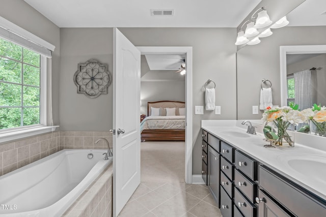 ensuite bathroom featuring visible vents, a garden tub, double vanity, ensuite bathroom, and a sink