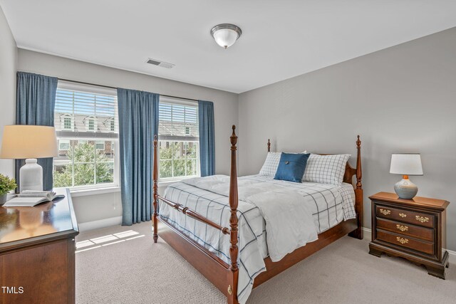 bedroom featuring carpet flooring, baseboards, and visible vents