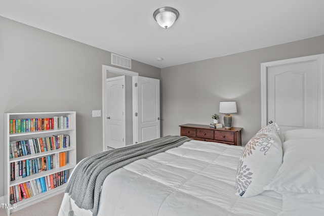 bedroom featuring visible vents