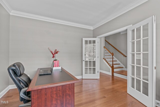 home office featuring ornamental molding, french doors, baseboards, and wood finished floors