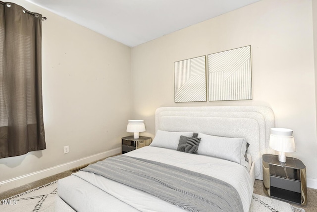 bedroom featuring carpet flooring and baseboards