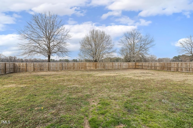 view of yard with a fenced backyard