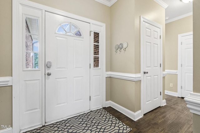 foyer entrance featuring dark wood-type flooring, baseboards, and ornamental molding