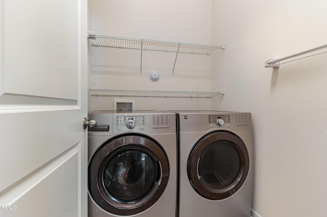 clothes washing area featuring laundry area and separate washer and dryer