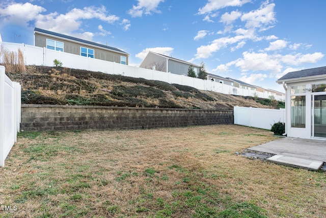 view of yard with a fenced backyard