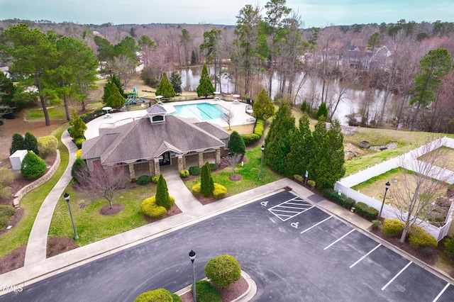 aerial view with a forest view and a water view