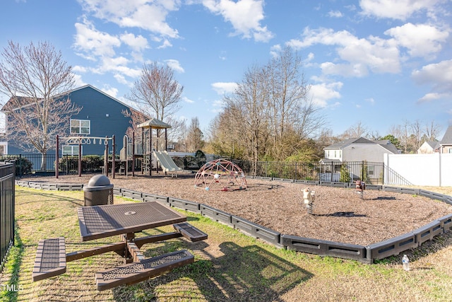 view of yard with playground community and fence