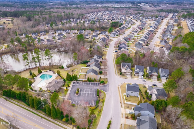 bird's eye view with a residential view and a water view