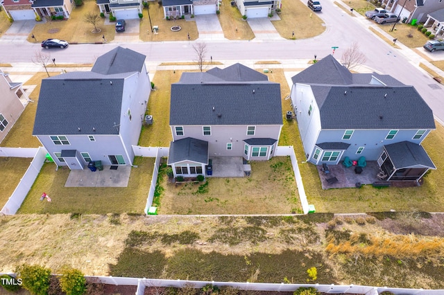 birds eye view of property with a residential view