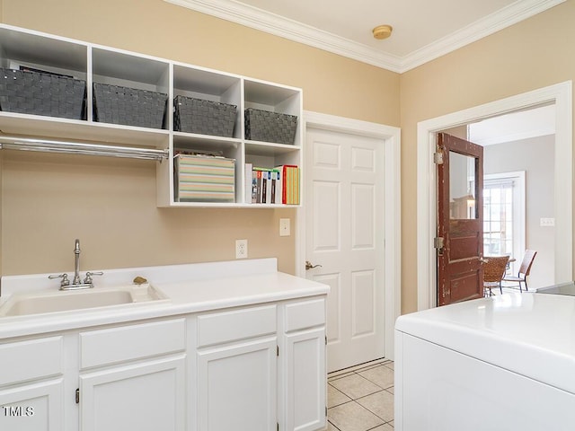 506 Wildwood Ln, Graham, NC 27253 - laundry room with ornamental molding, light tile patterned flooring, cabinet space, and washer / dryer