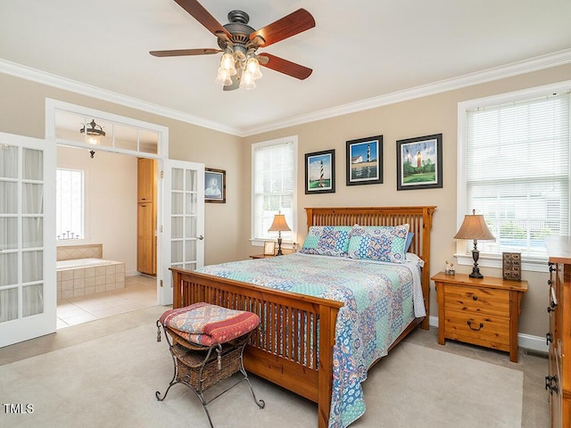 506 Wildwood Ln, Graham, NC 27253 - carpeted bedroom featuring french doors, ornamental molding, ensuite bath, a ceiling fan, and baseboards