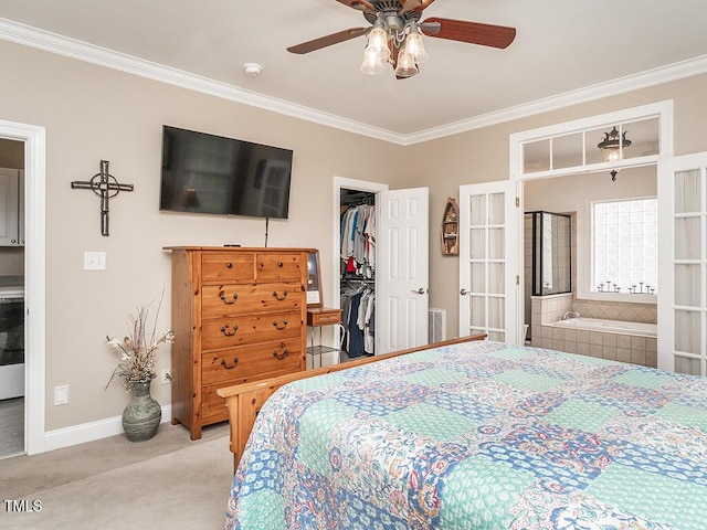 506 Wildwood Ln, Graham, NC 27253 - bedroom with ornamental molding, carpet, french doors, a walk in closet, and ensuite bathroom