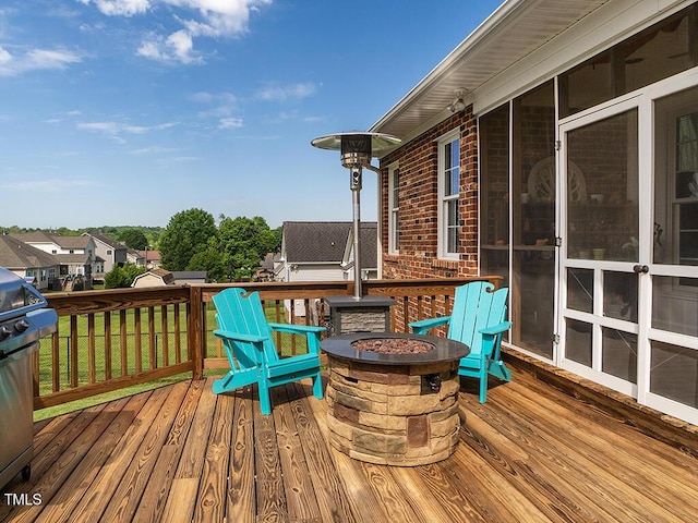 506 Wildwood Ln, Graham, NC 27253 - wooden deck with a fire pit and a residential view