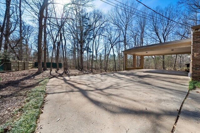 exterior space featuring a carport and driveway