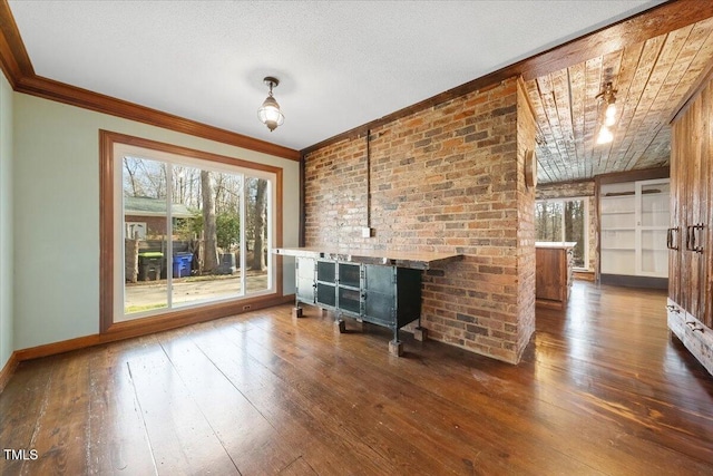 unfurnished living room with baseboards, a fireplace, hardwood / wood-style flooring, a textured ceiling, and crown molding