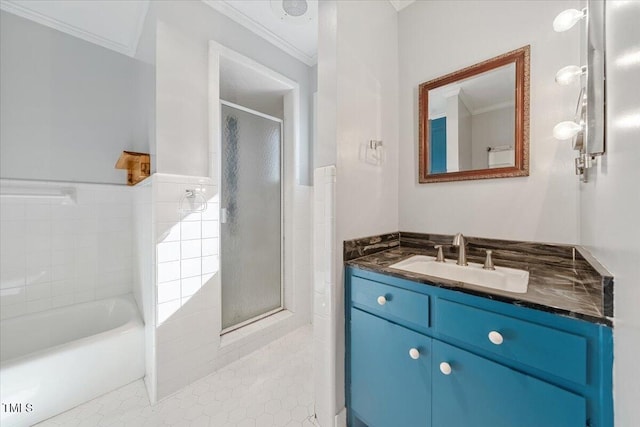 bathroom featuring vanity, ornamental molding, a shower stall, and a bath