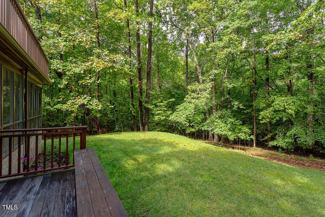 view of yard with a forest view