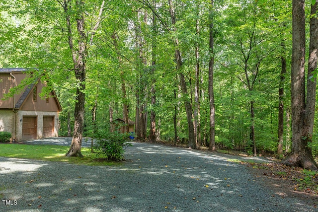 view of road featuring a view of trees