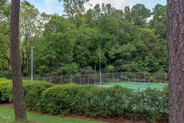 view of sport court with fence