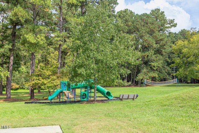 community jungle gym featuring a lawn