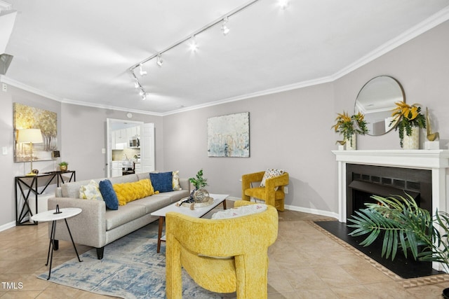 living room featuring tile patterned flooring, a fireplace with flush hearth, crown molding, and baseboards