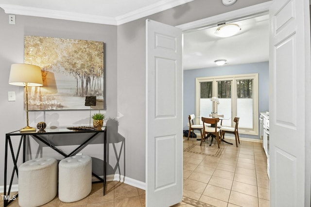 interior space featuring light tile patterned flooring, baseboards, and ornamental molding