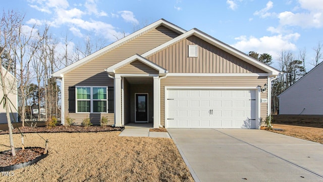 view of front of house featuring a garage, board and batten siding, and concrete driveway