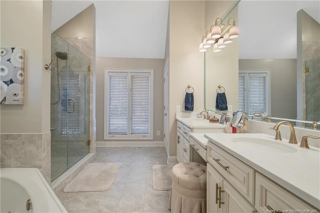 bathroom featuring vanity, baseboards, lofted ceiling, a stall shower, and a jetted tub