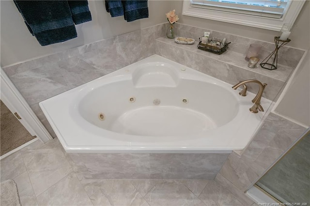 bathroom with a whirlpool tub