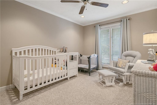 bedroom with crown molding, carpet flooring, and baseboards