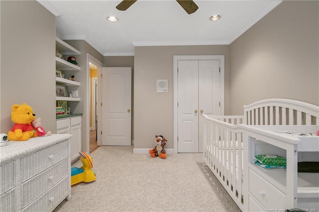 bedroom featuring baseboards, recessed lighting, a closet, crown molding, and light colored carpet