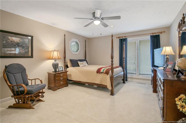 bedroom featuring recessed lighting, baseboards, light carpet, and a ceiling fan