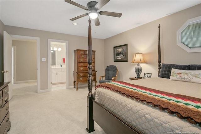 bedroom featuring baseboards, light carpet, ceiling fan, and ensuite bathroom